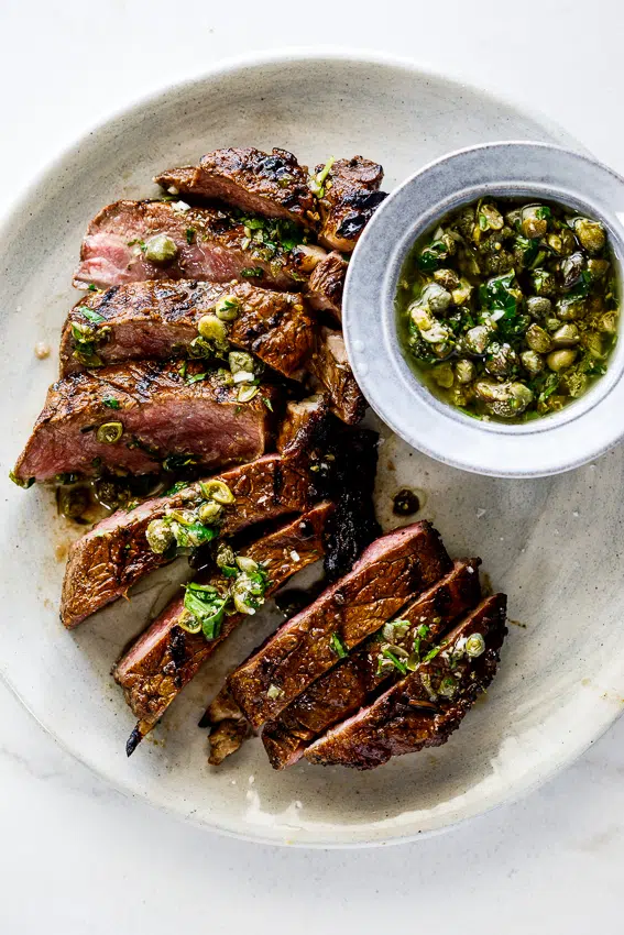 Grilled sirloin steak with caper herb sauce