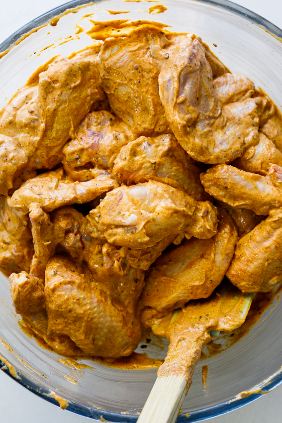 Chicken wings in tandoori marinade.