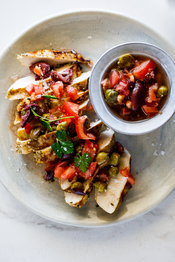 Chicken breasts with olive, tomato and caper dressing