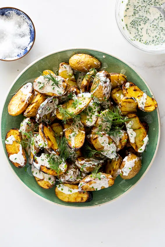 Potato salad made on the grill with sour cream dressing.