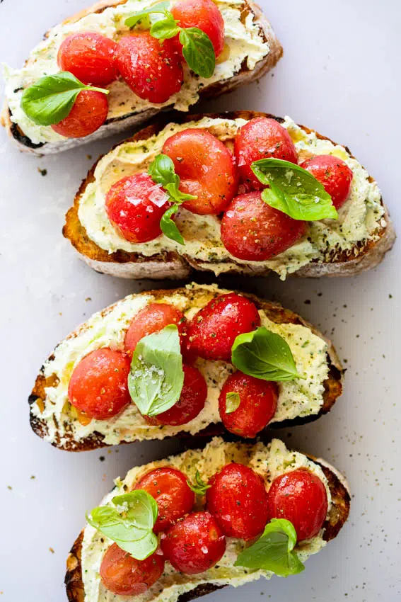 Crostini with marinated tomatoes and whipped feta