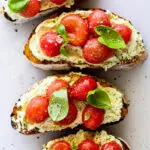 Crostini with marinated tomatoes and whipped feta