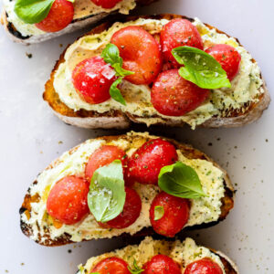 Crostini with marinated tomatoes and whipped feta