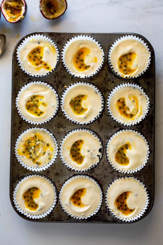 Mini cheesecakes with passion fruit swirl.
