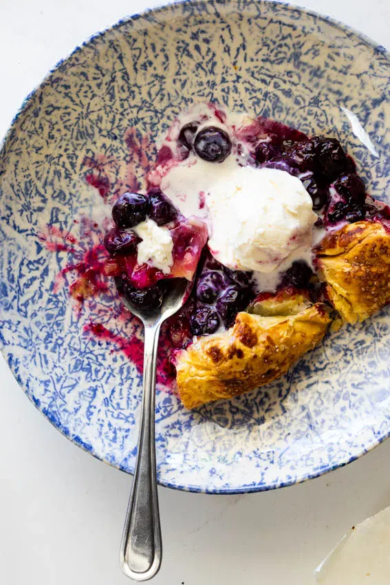 Blueberry galette with ice cream.