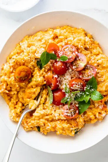 Instant pot tomato risotto with fresh basil and Parmesan.