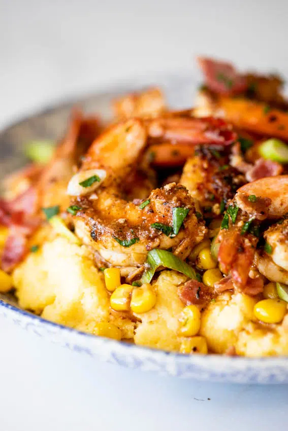 Shrimp and grits with bacon and corn.