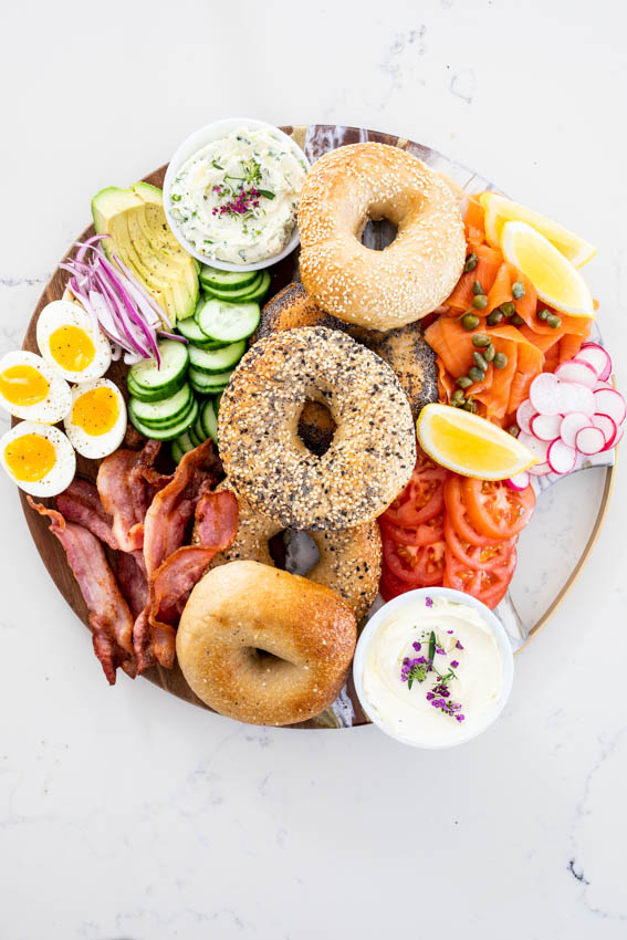 Bagel board with salmon, bacon and cream cheese.