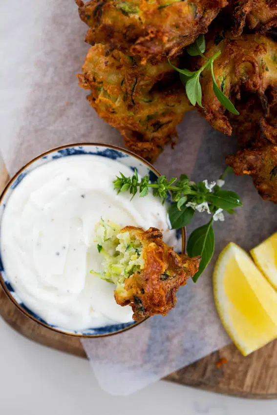 Cheesy zucchini fritters with garlic yogurt dip