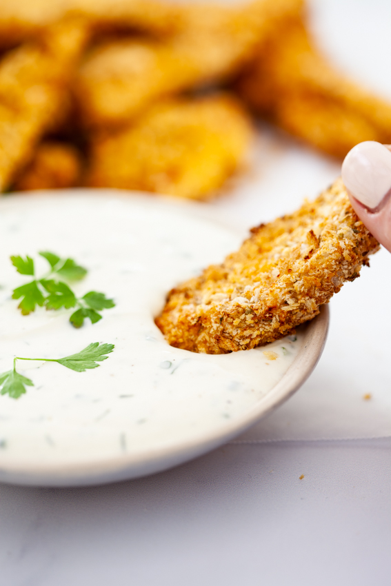 Chicken fingers dipped in Ranch dressing.