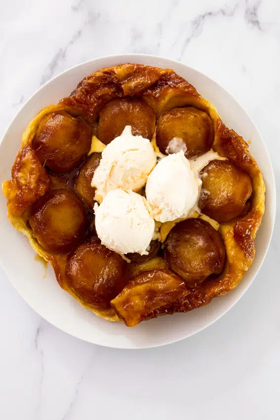 Apple tarte tatin with crisp puff pastry and vanilla ice cream.