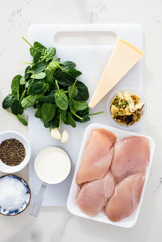 Ingredients for creamy spinach artichoke chicken.