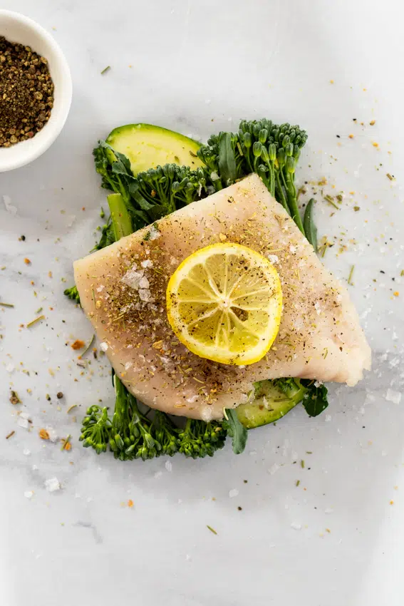 Fish, vegetables, lemon and garlic in parchment paper.
