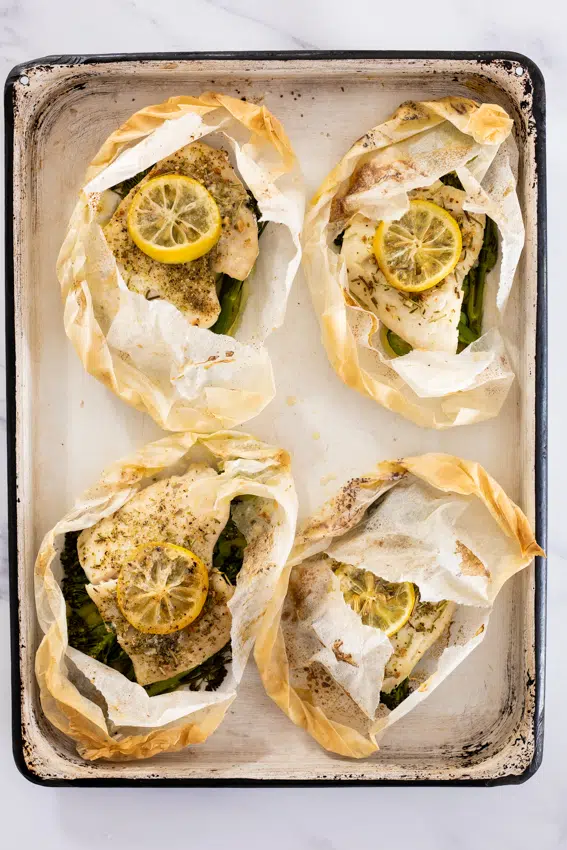 Fish en papillote with vegetables and lemon.