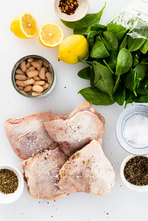 Ingredients for one pan lemon chicken and spinach.