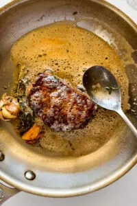 Steak basted with butter.