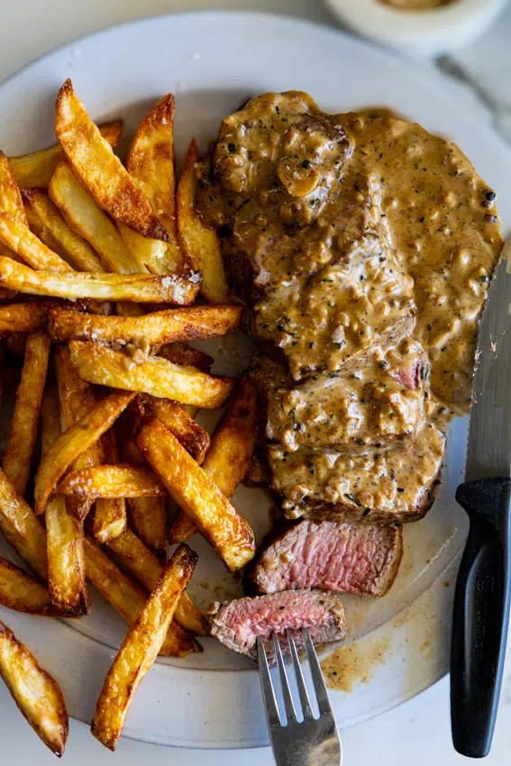 Steak au Poivre with French fries.