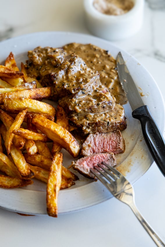 Steak au Poivre with air fryer French fries.