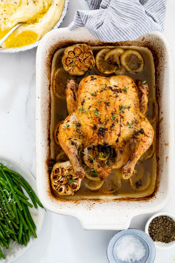 Juicy roast chicken with lemons and garlic.