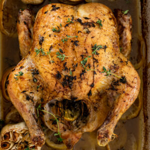 Juicy roast chicken with lemons and garlic.
