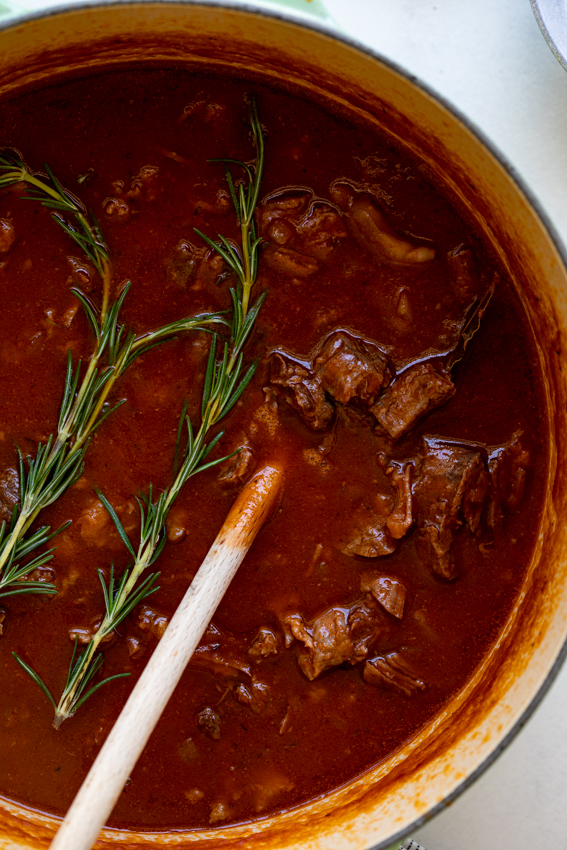 Slow braised beef ragu flavored with rosemary and red wine.