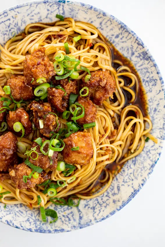 Crispy pork with saucy spicy noodles