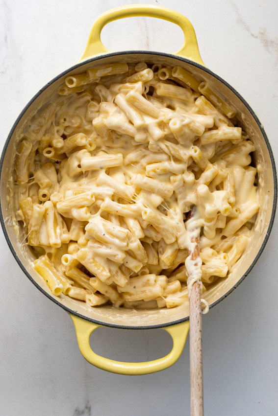 Macaroni coated in extra cheesy sauce for baked mac and cheese.