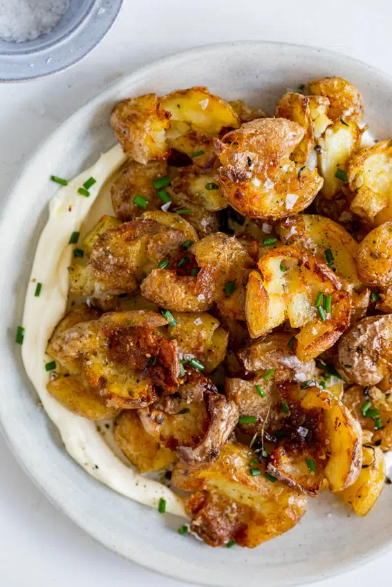 Smashed baby potatoes with sour cream and chives.