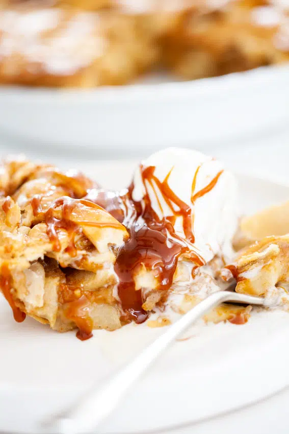 Apple pie served with ice cream and salted caramel.