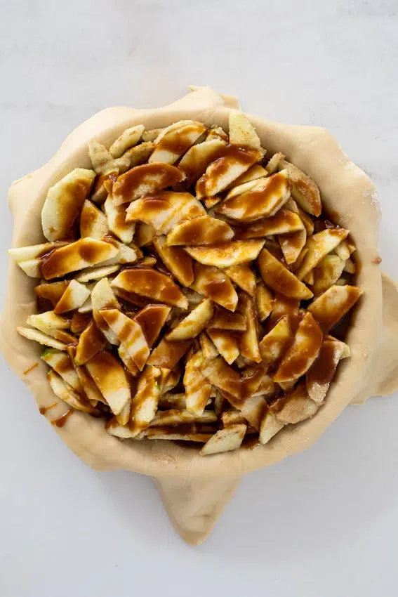Granny Smith apples topped with homemade salted caramel inside buttery pastry.