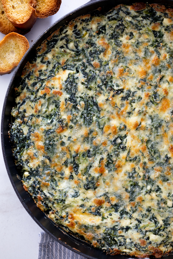 Spinach dip made with four cheeses is the ultimate indulgent appetizer.