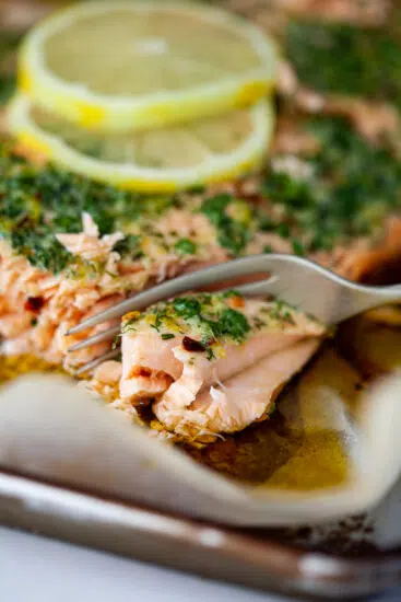 Succulent baked salmon flavored with garlic herb butter