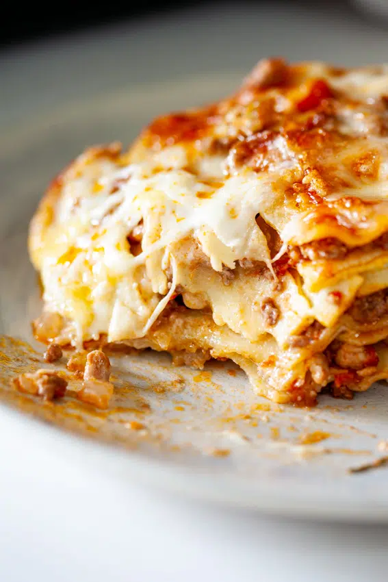 Layers of pasta, bolognese sauce and cheese sauce makes homemade lasagna the ultimate comfort food.
