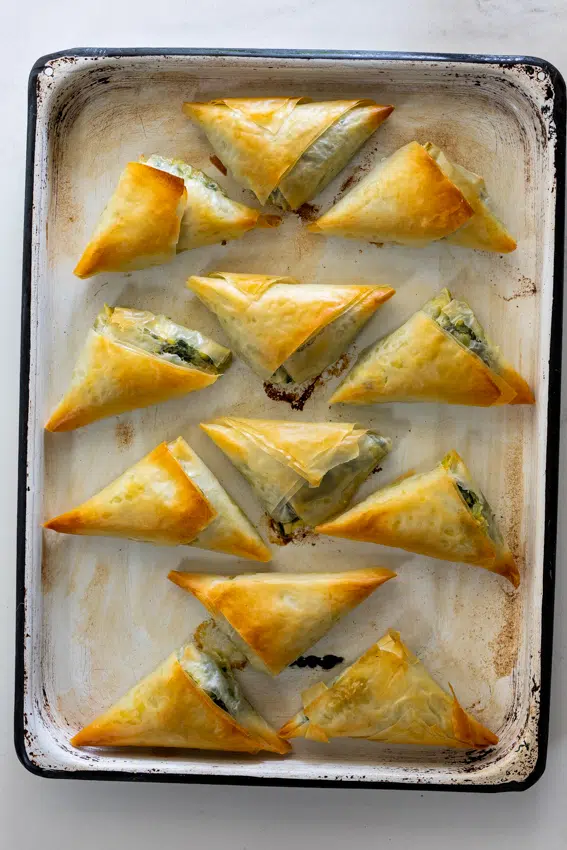 Mini Spanakopita on sheet pan.