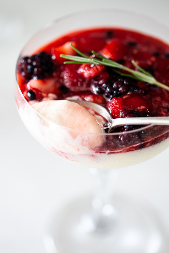 Soft and creamy white chocolate panna cotta with berries.
