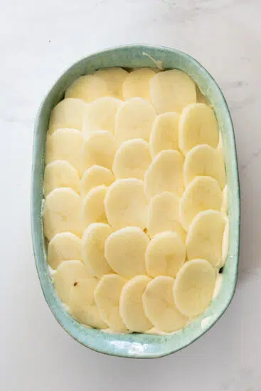 Scalloped potatoes with creamy cheese sauce.