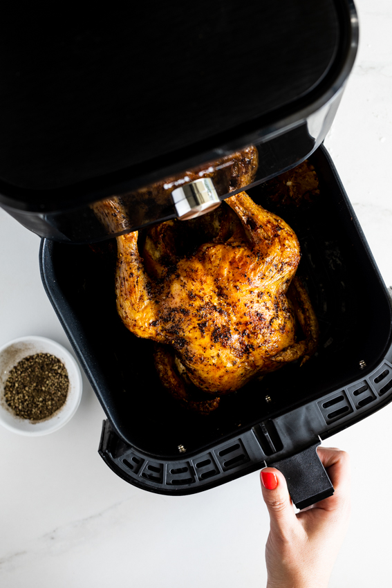 Whole chicken cooked in an air fryer.