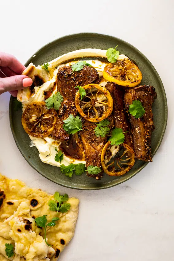 Sesame sumac lamb chops served with whipped feta cheese and honey.