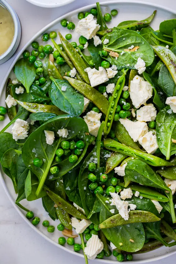 Warm Spinach Salad with Feta and Peas