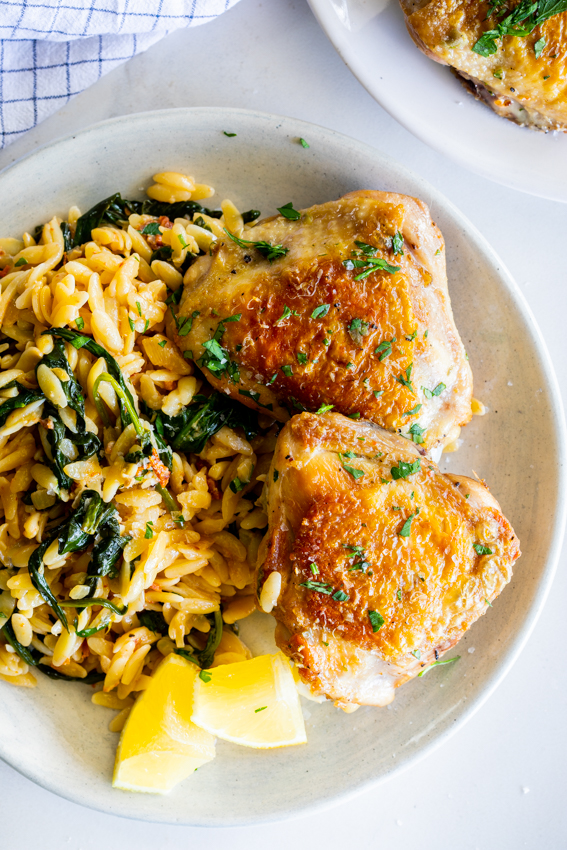 Tomato Spinach Orzo Pasta with Crispy Chicken Thighs