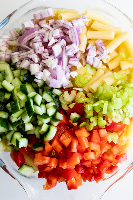 Curried macaroni salad with peppers, cucumber and peaches.