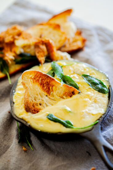 Easy baked brie with honey and crispy sage.