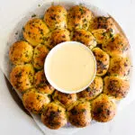 Garlic butter bread wreath with fondue dip