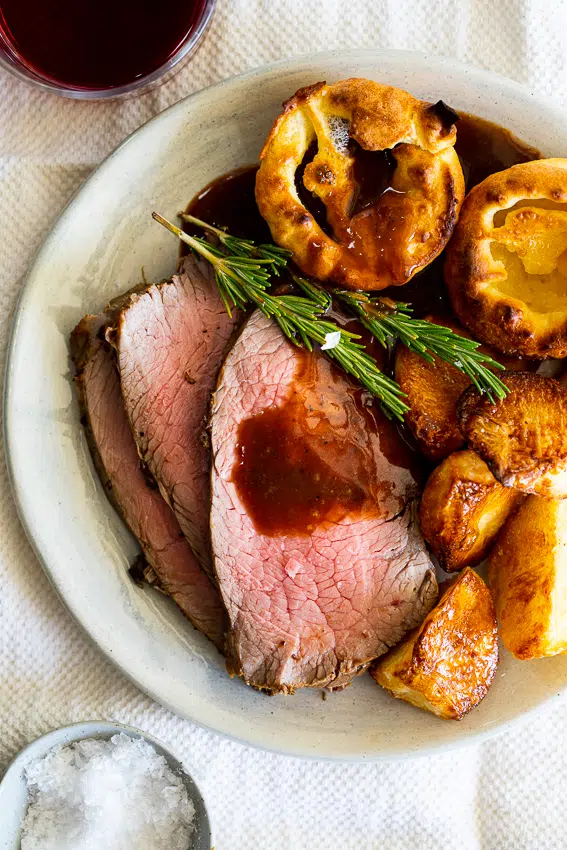 Garlic Rosemary Rump Roast with roasted potatoes and gravy.