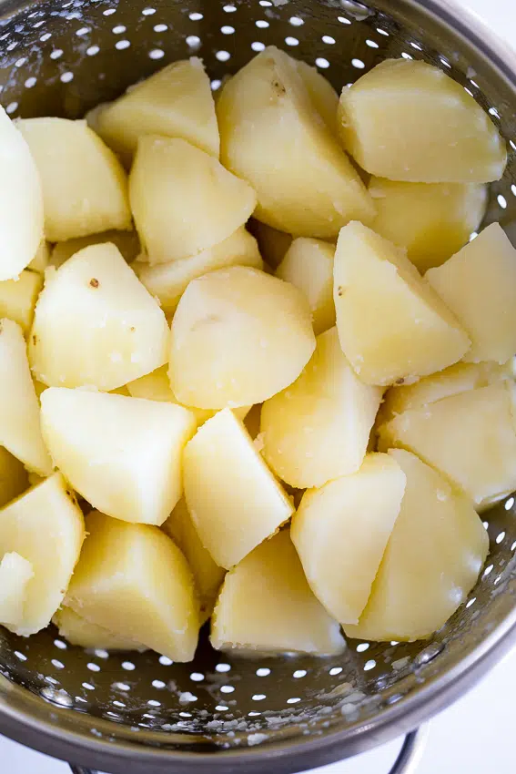 Boiled potatoes in colander