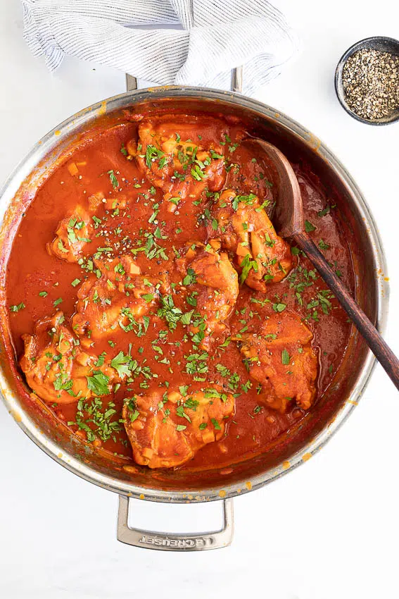 Braised chicken Osso Buco in rich tomato sauce.