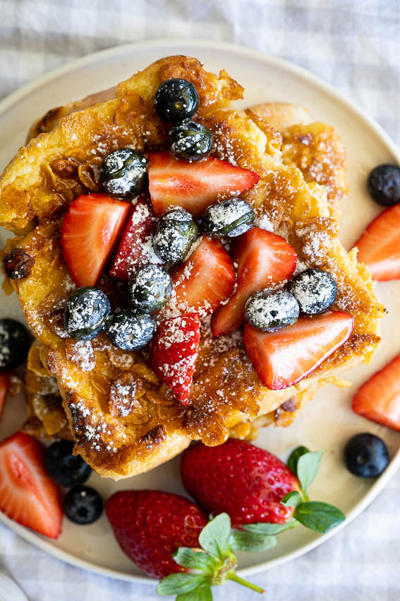 French toast with berries and maple syrupa