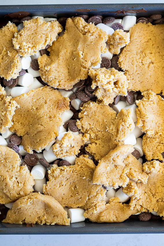 S'mores bars with Nutella, marshmallows and chocolate chips layered with buttery cookie dough