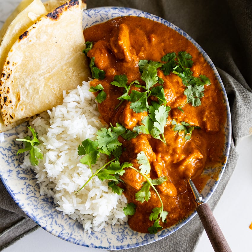 Butter Chicken Curry (Murgh Makani) with rice and roti.