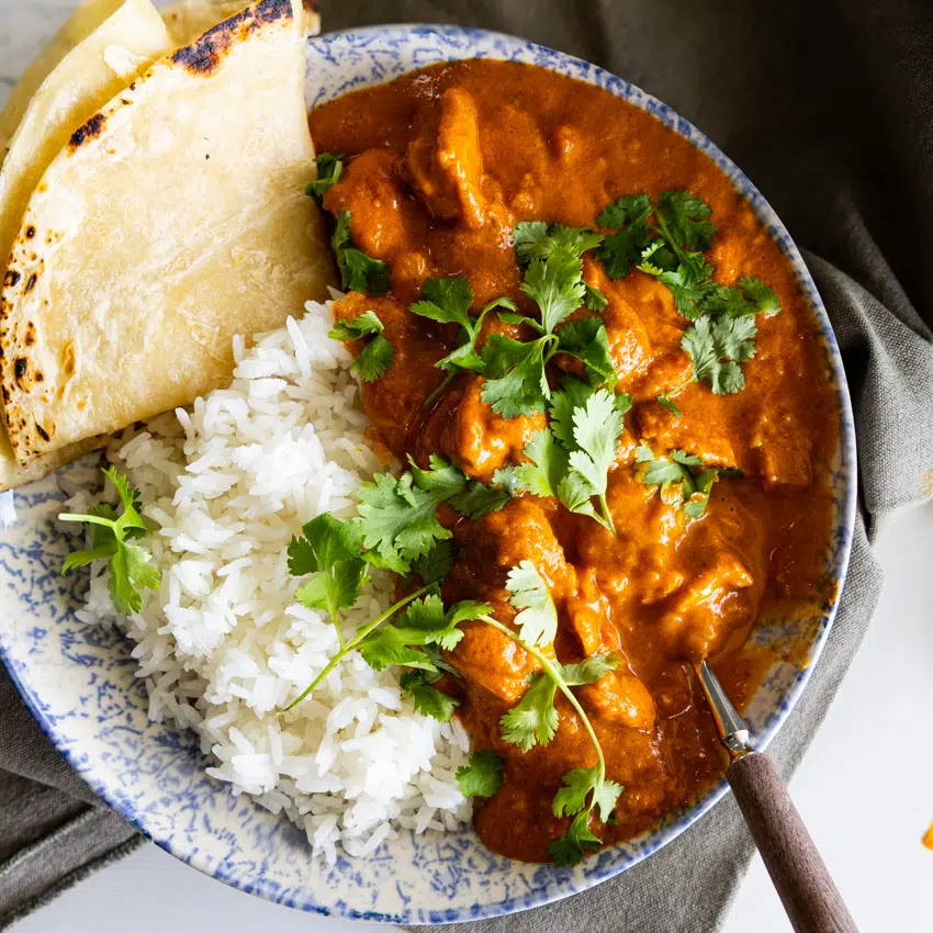 Butter Chicken Curry (Murgh Makani) with rice and roti.